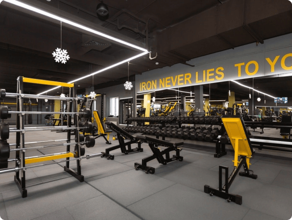 Free-weight floor with dumbbells and benches