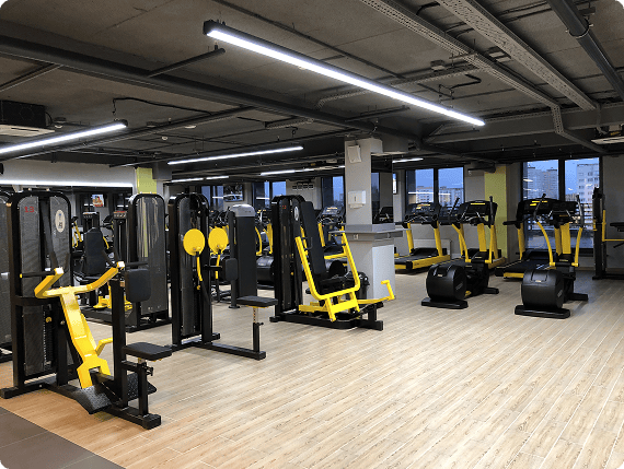 Cardio and strength area with yellow machines