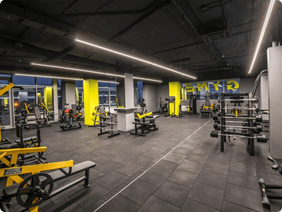 Open gym floor with windows overlooking the city